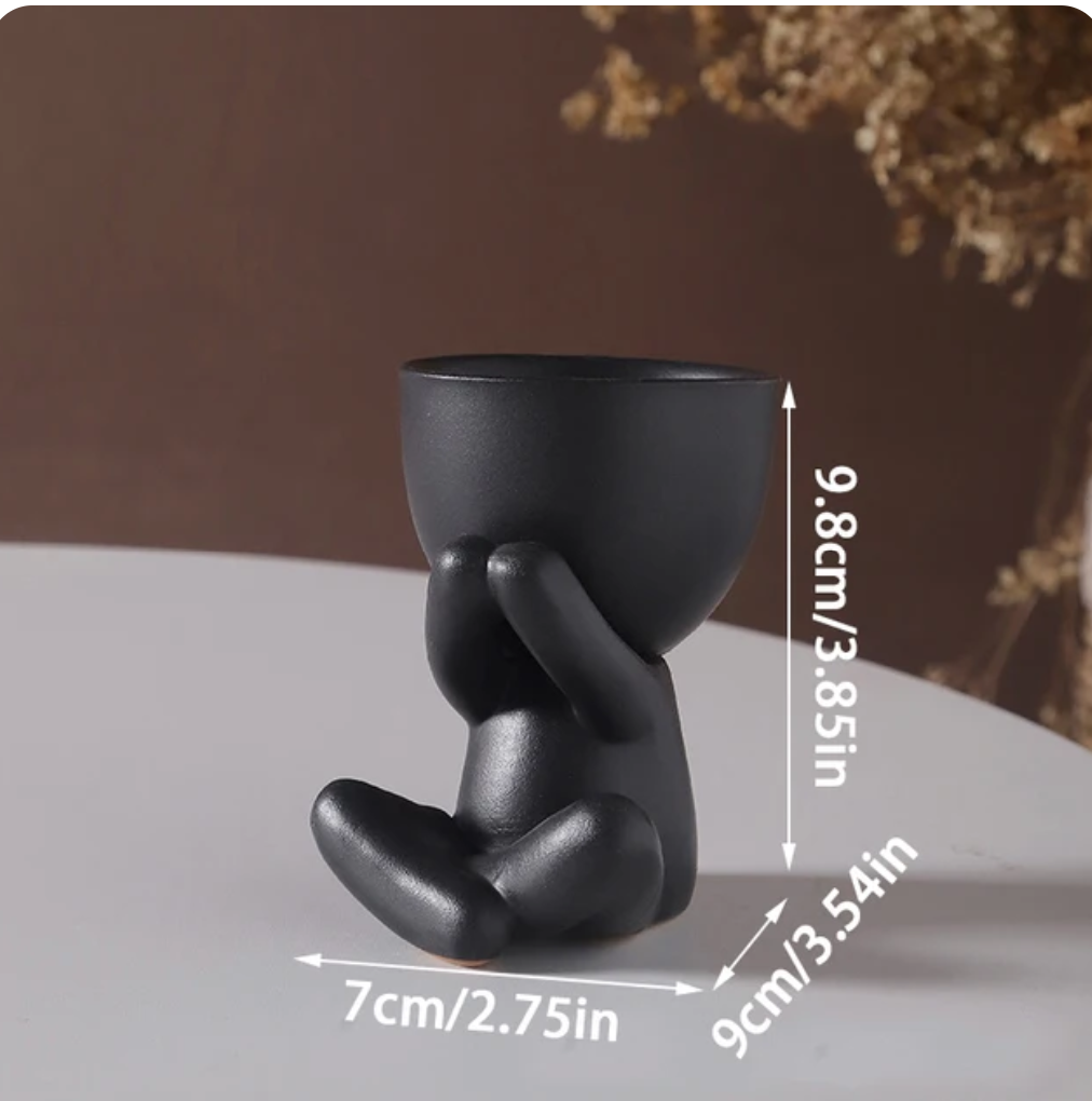 humanoid ceramic flower pot